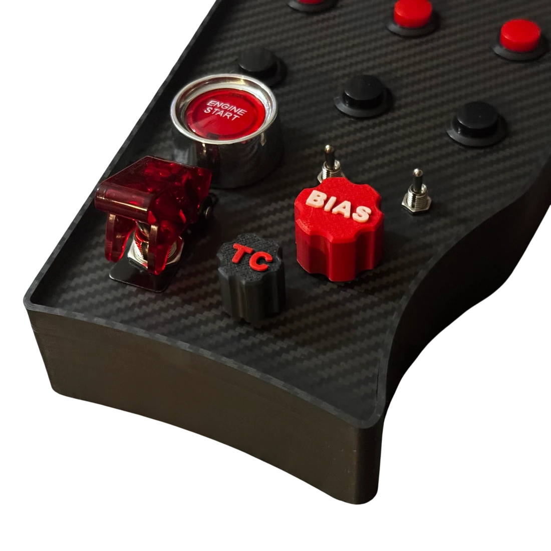 Close-up of the GT3 Console Button Box engine start button, brake bias dial and missile cover switch
